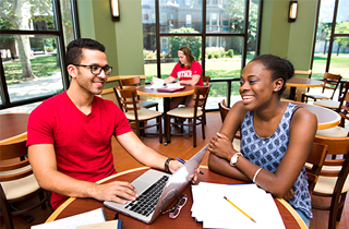 Students studying in a Rutgers University-Camden library 